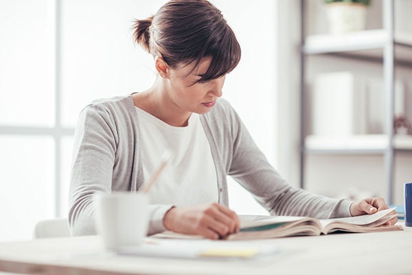 woman reading information on her HOA